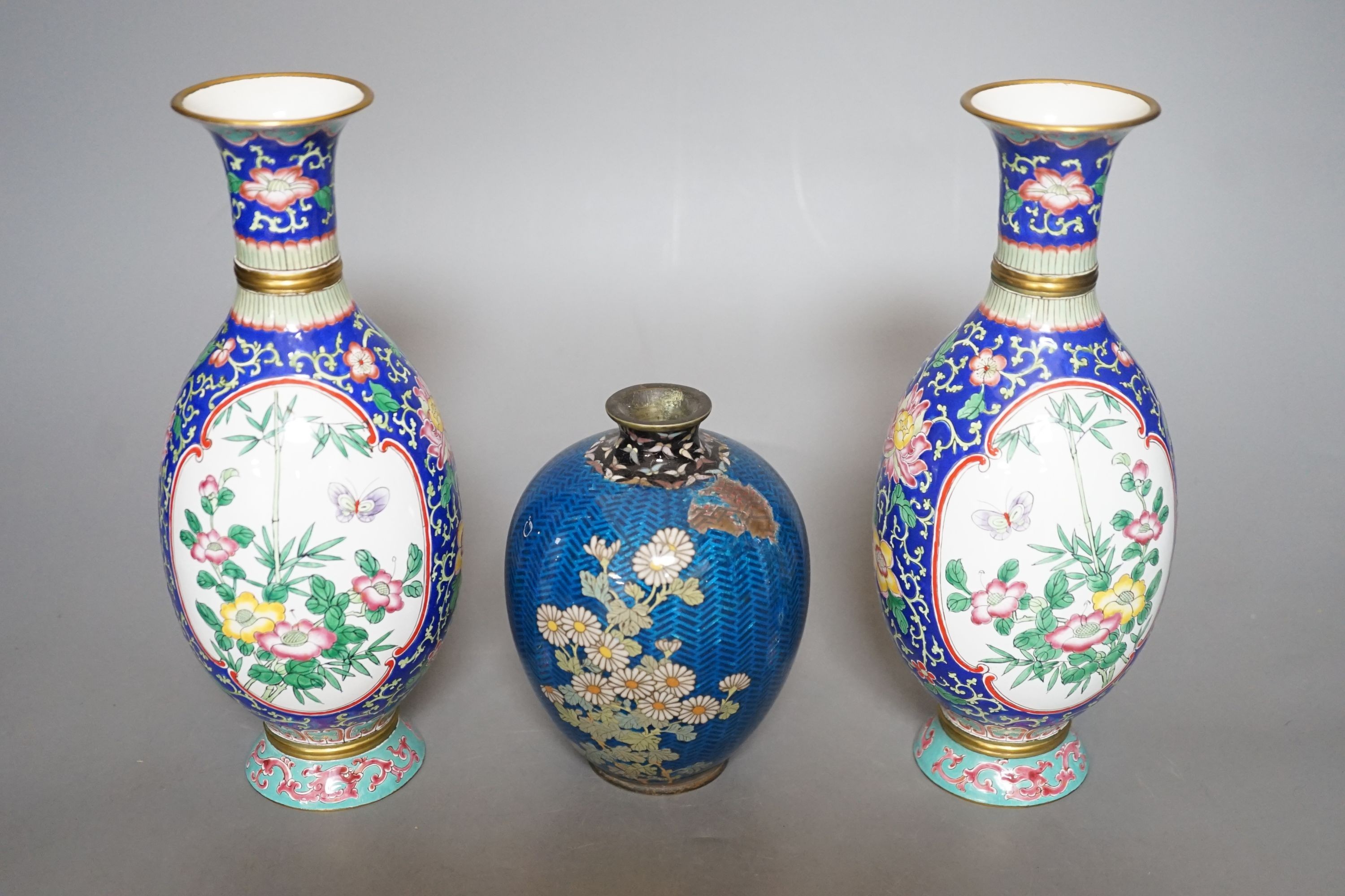 A Japanese floral cloisonné enamel vase, 13cm tall, together with two Canton enamel vases